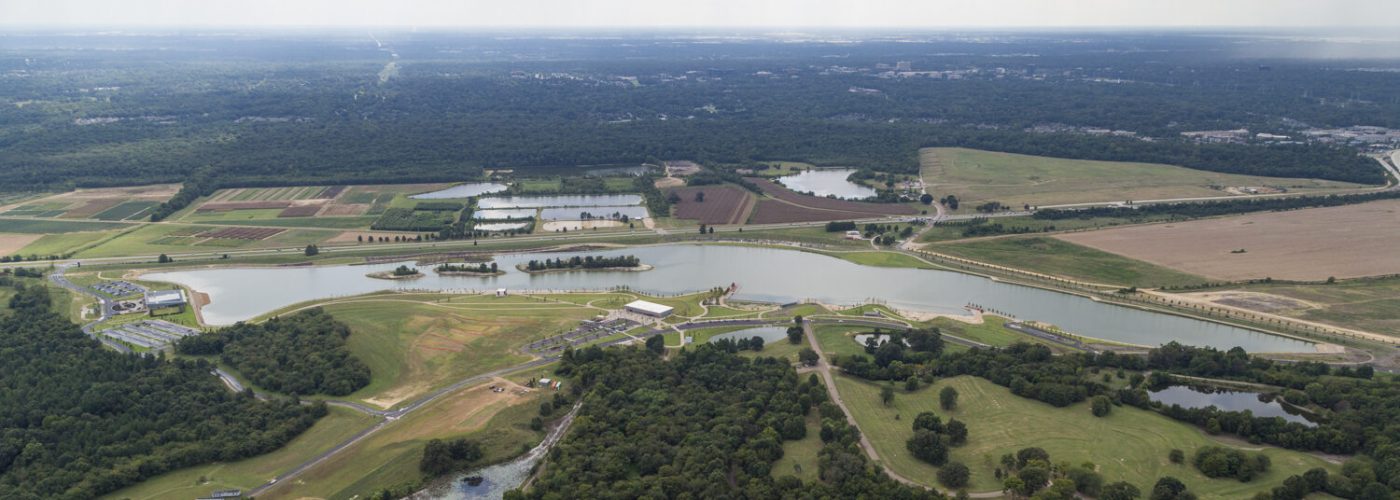 Aerial birds-eye view of the lake and the Heart of the Park project.