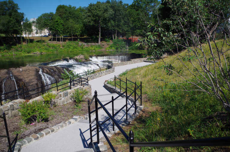 A photograph showing the steps and pathway leading to the falls observation area. The Falls can be seen in the background.