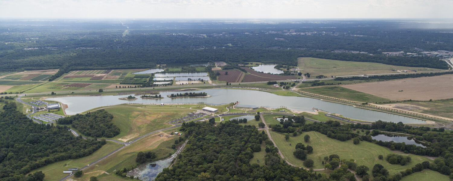 Aerial birds-eye view of the lake and the Heart of the Park project.
